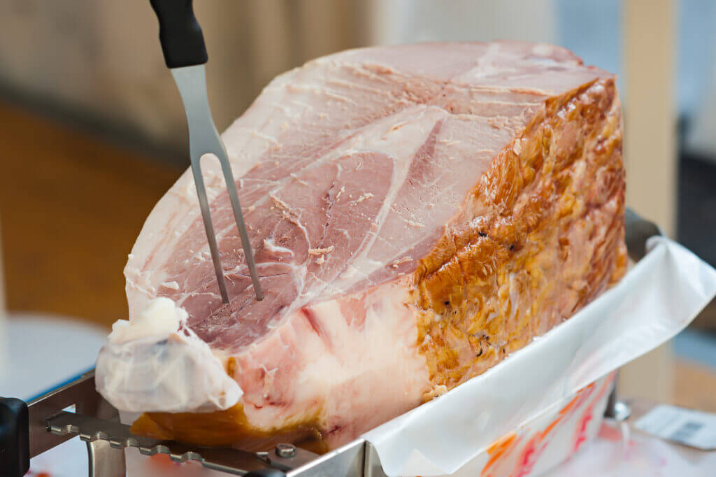 Italian cooked ham ready to be sliced.